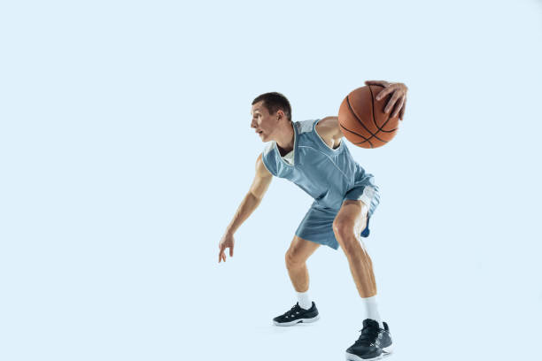 istock Young caucasian basketball player against white studio background 1189156718
