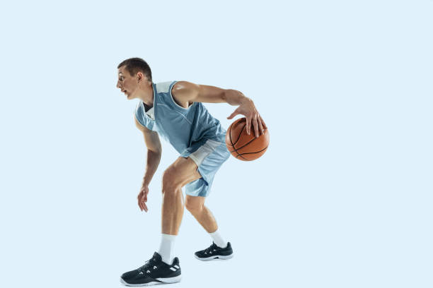 istock Young caucasian basketball player against white studio background 1189156722