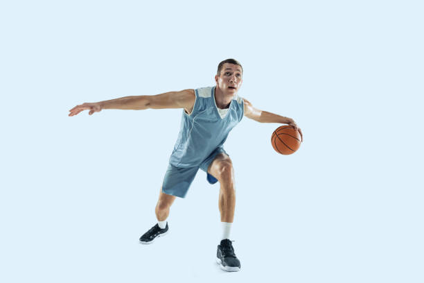 istock Young caucasian basketball player against white studio background 1189156727