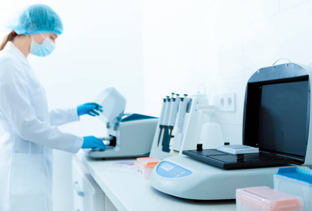 istock Blurred woman using professional medical equipment in lab 1189157098