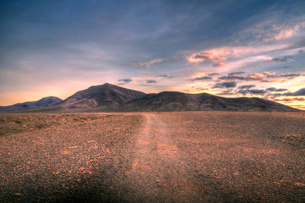 istock Trodden path leading over time to the mountains 1189157368