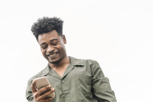istock smiling young african black man looking the phone 1189157731