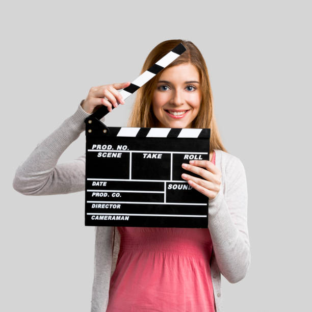istock Beautiful girl holding clapboard 1189158330