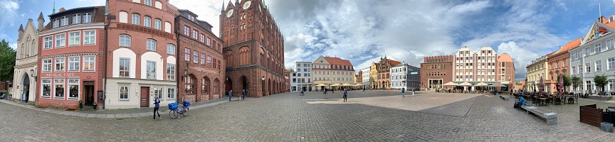 Stralsund, Germany - September, 28 - 2019:  Panoramic view of the market square. Some people walking by.