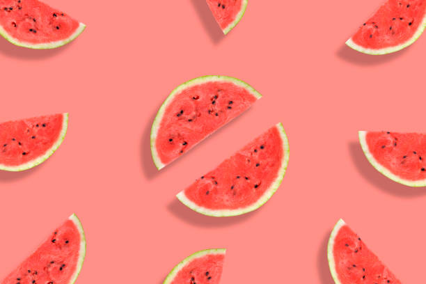 istock Flat lay of watermelon half slices on pink background. Watermelon pattern. 1189160182