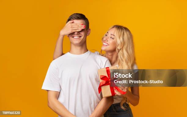 Loving Girlfriend Prepared Surprise To Young Guy Stock Photo - Download ...