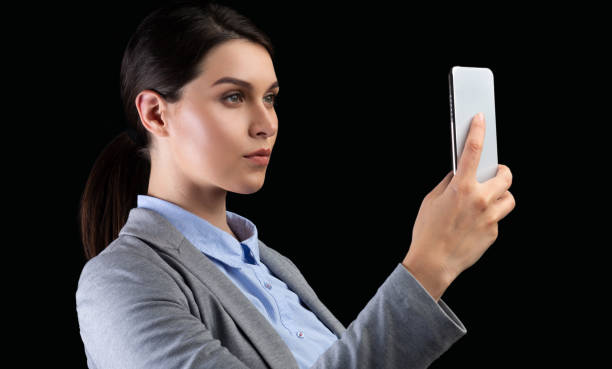 istock Business Lady Using Smartphone Identifying Person Standing On Black Background 1189160341