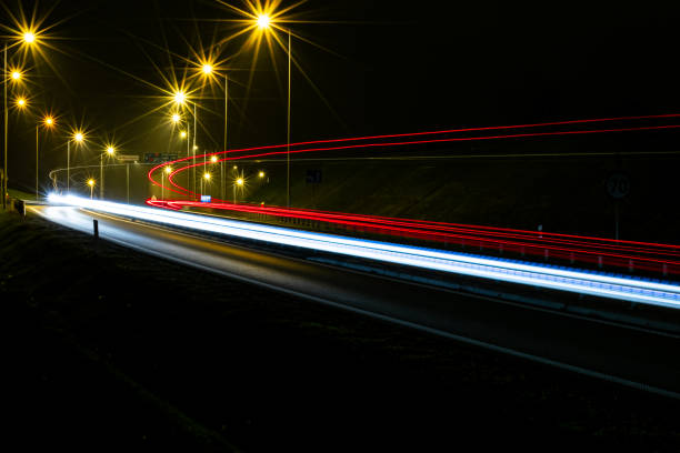 istock lights of cars with night 1189161483
