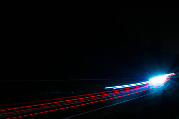 istock lights of cars with night 1189161673