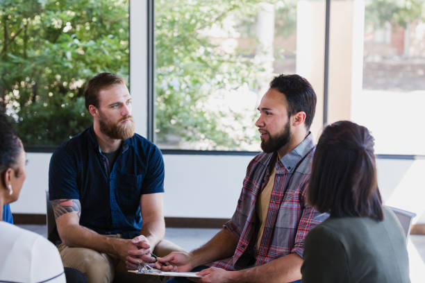 istock Attentive people listen to therapist during group therapy session 1189163305