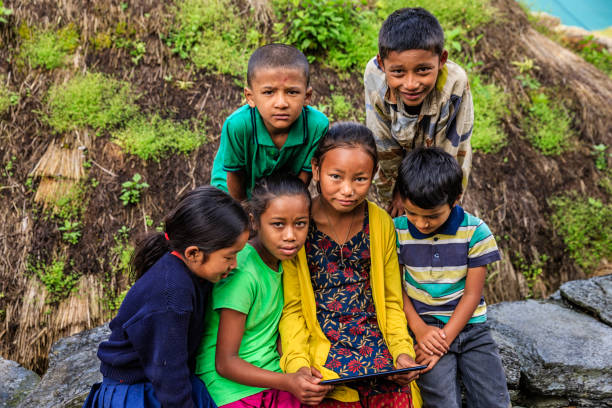 istock Nepali children using digital tablet near Annapurna Range 1189164514
