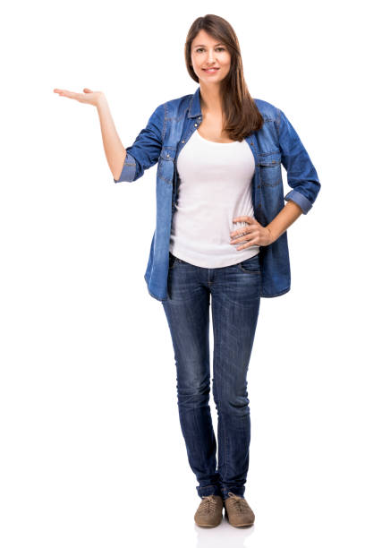 istock Beautiful woman showing something over a white background 1189165814