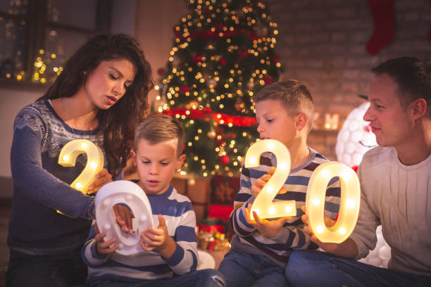 istock Family holding illuminative numbers 2020 1189166628