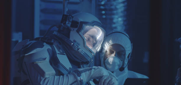 istock Scientist helping astronaut to put on gloves 1189166969