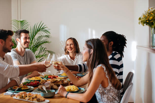 istock Friends Celebrating and Rising Wine Glasses 1189167916