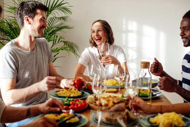 istock A Woman Enjoying Dinner with Friends 1189167976