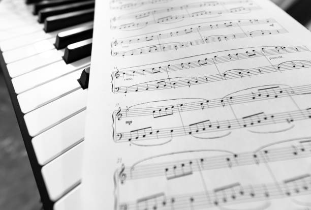 classic piano and musical sheet . black and white photo, musical background - piano piano key orchestra close up imagens e fotografias de stock