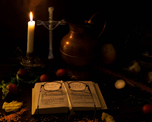 istock Prayer on wood table, candle and cross. 1189171397