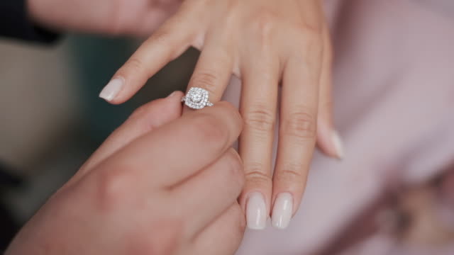 Wedding rings. Guy Put The Ring On The Girl's Finger.