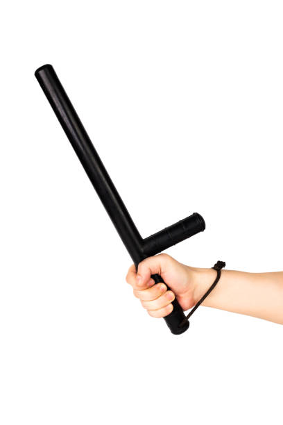 istock bare hand with black rubber police baton isolated on white background 1189175212