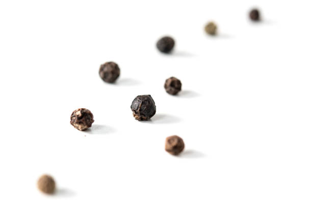 istock grains of black pepper on a white background 1189175232