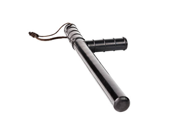istock Black classic rubber police tonfa baton isolated on white background. 1189175290