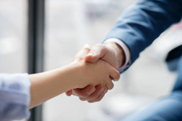 istock Businessman shaking hand of his assistant after help and assistance 1189175979