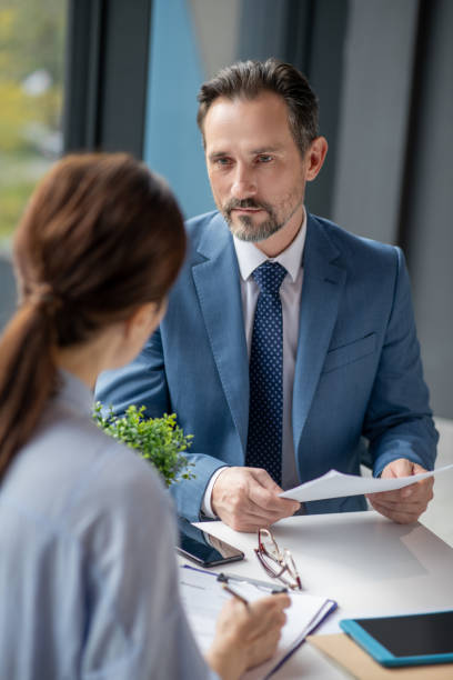 istock Businessman talking to his female business partner while discussing project 1189176010