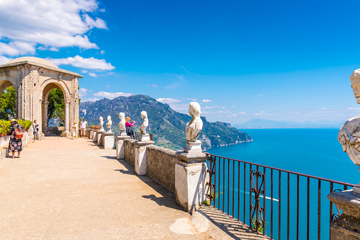 Tourists at the Terrace of Infinity at the gardens of Villa Cimbrone, Ravello, Italy.