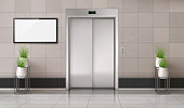 istock Office hallway with elevator and TV screen 1189177280