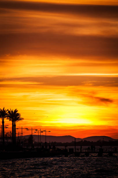istock A full sun setting over the sea, reflecting in the water 1189177321
