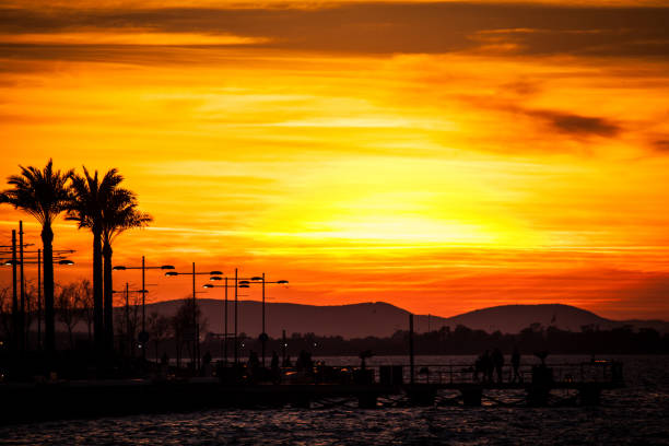 istock A full sun setting over the sea, reflecting in the water 1189177380