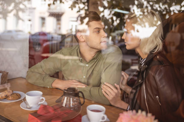 istock Couple discussing their plans in the cafe 1189179052