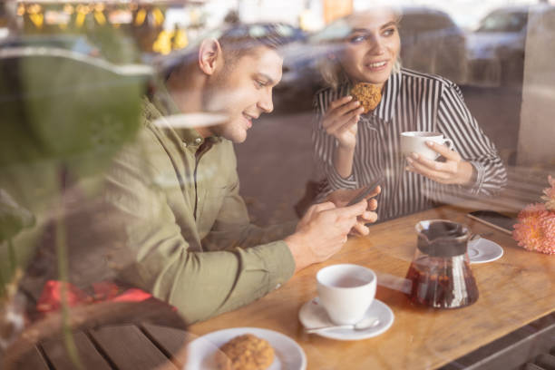 istock Cheerful couple having breakfast in the coffee shop 1189179073