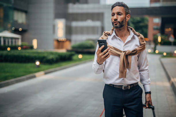 istock Man calling for taxi 1189180692