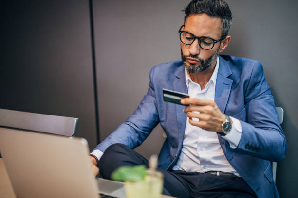 istock Man with credit card in cafe 1189181487