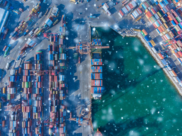 istock Aerial view of cargo ship ready for transit in Winter. Snowing. 1189183751