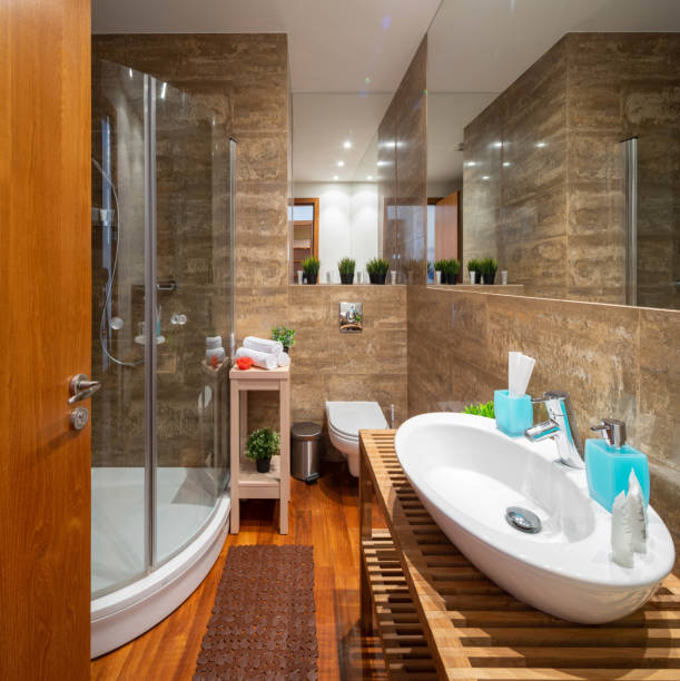 istock Modern interior of bathroom. Shower cabin. Brown tile. 1189184673