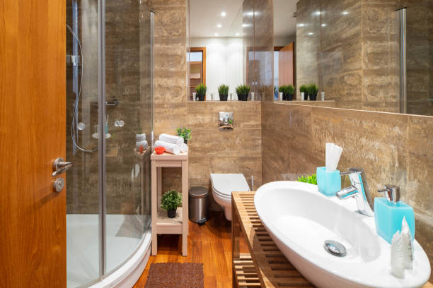 istock Modern interior of bathroom. Shower cabin. White sink. 1189184679