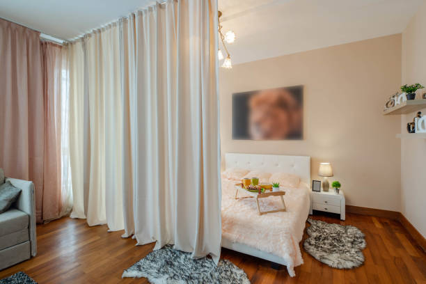 istock Modern interior of studio apartment. King-size bed. 1189184702