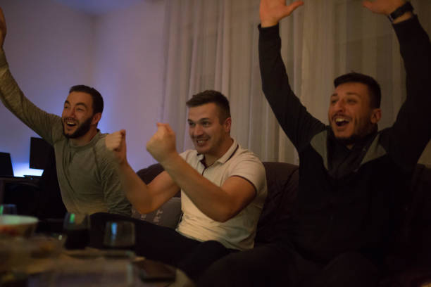 istock Male friends watching a soccer match 1189184802