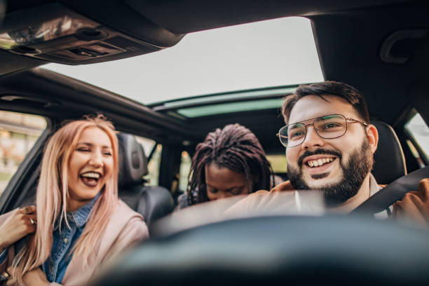 istock Friends traveling by a car 1189186434