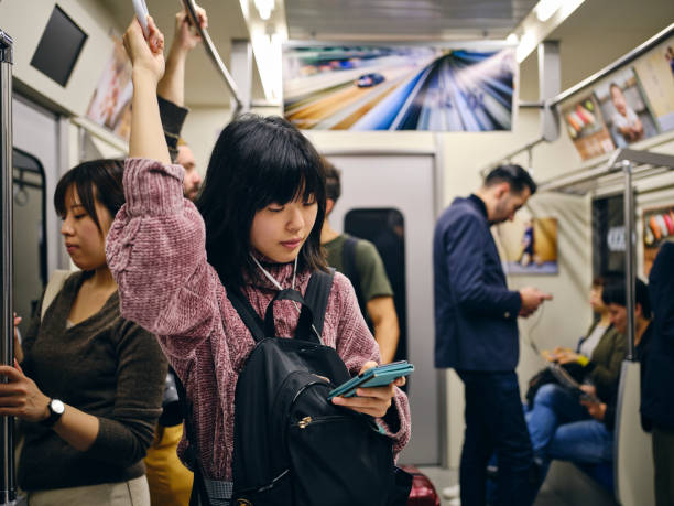 Young Woman on a Crowded Japanese Subway Train