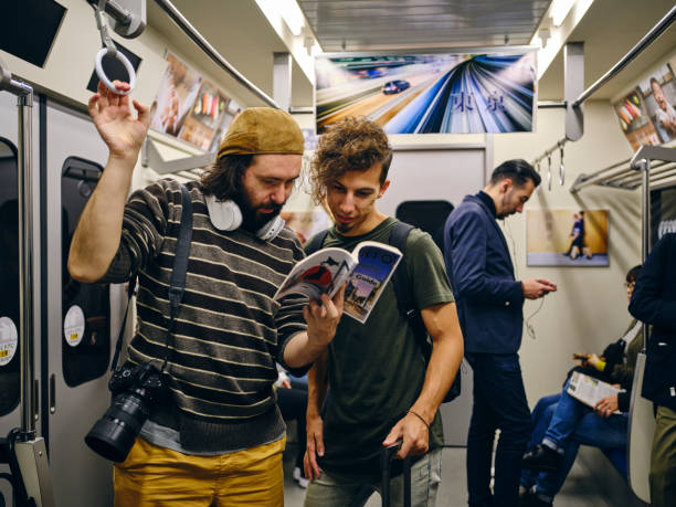 istock Tourists on a Crowded Japanese Subway Train 1189189561
