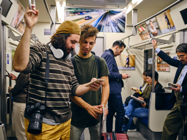 istock Tourists on a Crowded Japanese Subway Train 1189189584