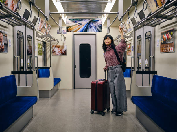 istock Young Woman on an Empty Japanese Subway Train 1189189859