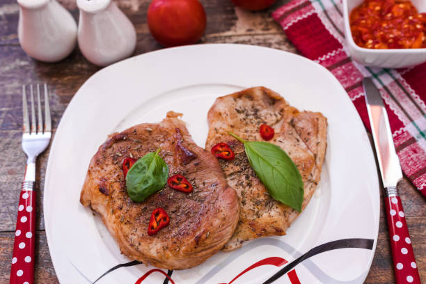 istock Fresh made pork chops with potato and chili sauce 1189189893