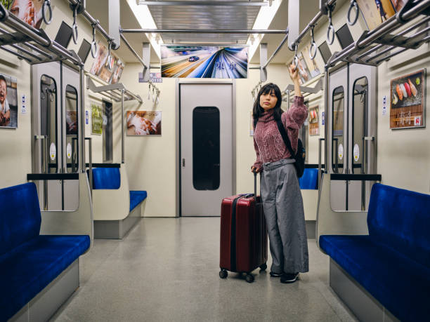 istock Young Woman on an Empty Japanese Subway Train 1189190287