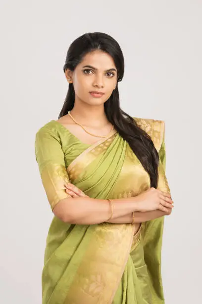 Photo of Beautiful young girl posing in traditional saree