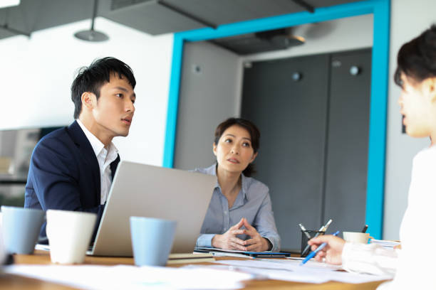 istock Group of business persons in discussion 1189190718